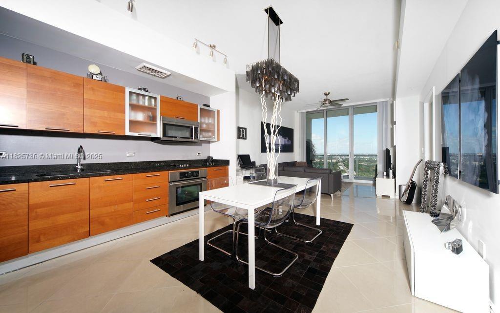 Stunning 1BD/1.5BA on the 26th floor with panoramic water views in Midtown 2. Features floor-to-ceiling impact windows, ceramic floors, stainless steel appliances, stone countertops, blackout blinds, brand new oven/cooktop, and brand new in-unit washer/dryer. Building offers rooftop pool, spa, sauna, steam room, gym, 24-hr valet, and 1 covered parking. Pet-friendly. Prime Design District location, steps to retail and Wynwood. Available August 1st.