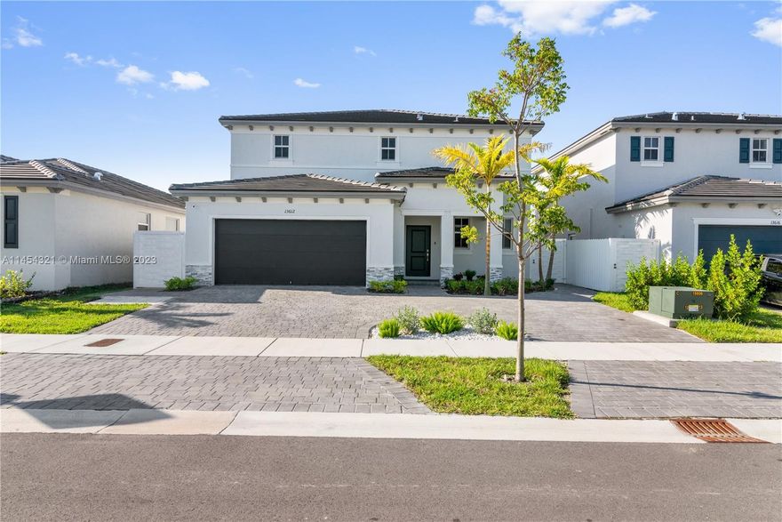 Welcome to your dream home! This stunning 6 Bed & 4.5 Bath property built in 2022, provides ample space for living together with your huge family or can be separated into 3 units, each one with its own privacy. Main house used as a 4/2.5 connected to the legal In-Law Suite through a door by the living room.In-Law Suite is 1/1 with laundry and kitchenette. Garage is converted to a Studio/Man cave. Granite counters & SS appliances in the kitchen. Zebra curtains on 1st floor & blackout curtains on 2nd floor. Fenced patio with an aluminum terrace and concrete pads backyard. The circular and extended driveway completes this impressive property. This is a smart home, ask for the extended list of smart devices included in the sale. Don't miss the opportunity to call this house your home!