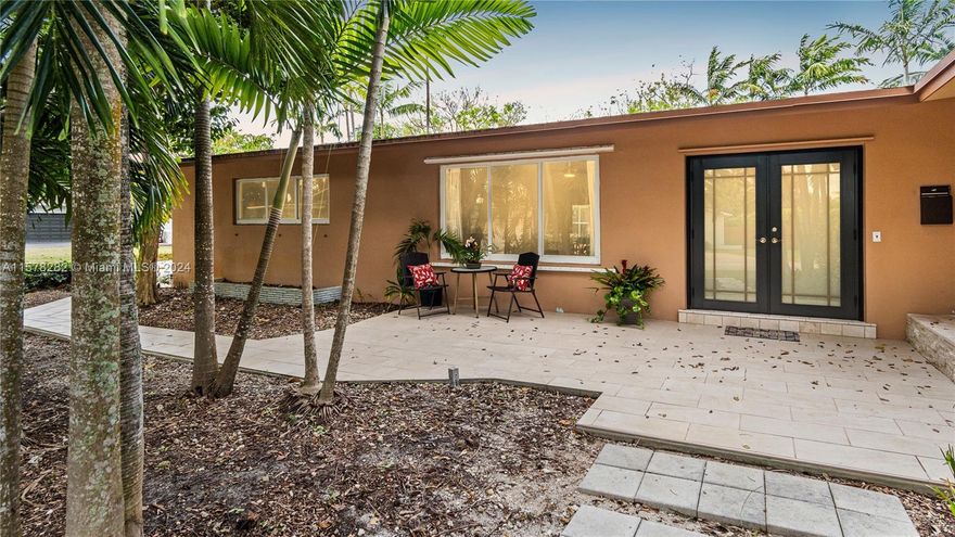 Discover the epitome of splendor living in this prestigious estate home. Step into your dream home with an open split floor plan that seamlessly flows from room to room. Retreat into junior or master suites, each offering cabana bathrooms out into the screen-enclosed saltwater pool area, surrounded by lush vegetation and fruit trees.  Features upgraded bathrooms, a gourmet gas kitchen complete with a double snack bar, an 8 year old roof, impact windows, modern wood-look tile flooring throughout, large custom-built master closets. Enjoy the convenience of a private bedroom wing, a large driveway for guest parking and a 2 car garage. Experience comfortable living with this meticulously designed home, where every detail that you could ever want exists for even the most discerning buyer.