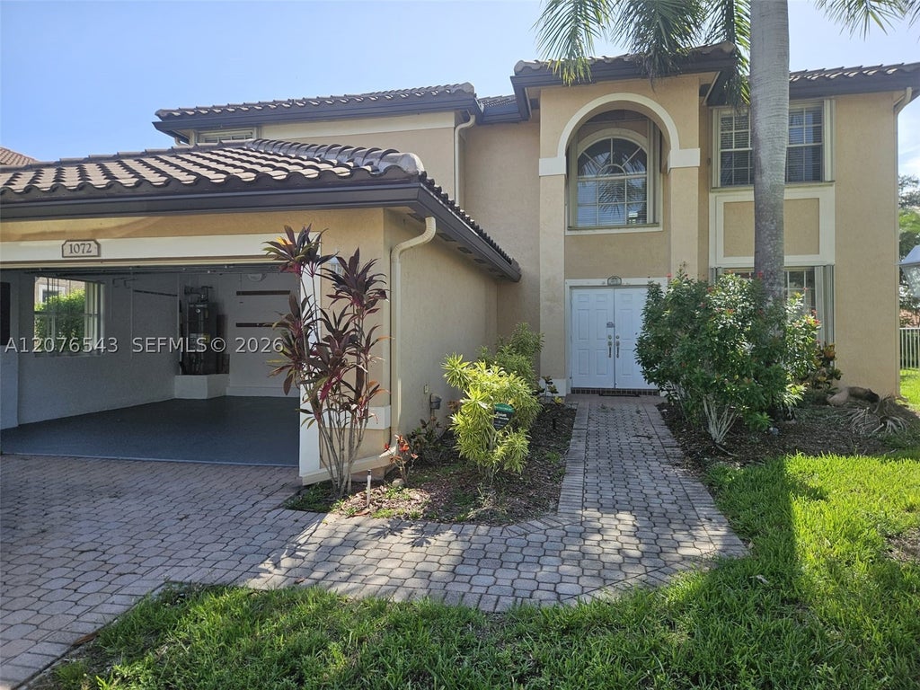 Photo of 1072 NW 139th Ter, Pembroke Pines, FL 33028 (MLS # A12076543)