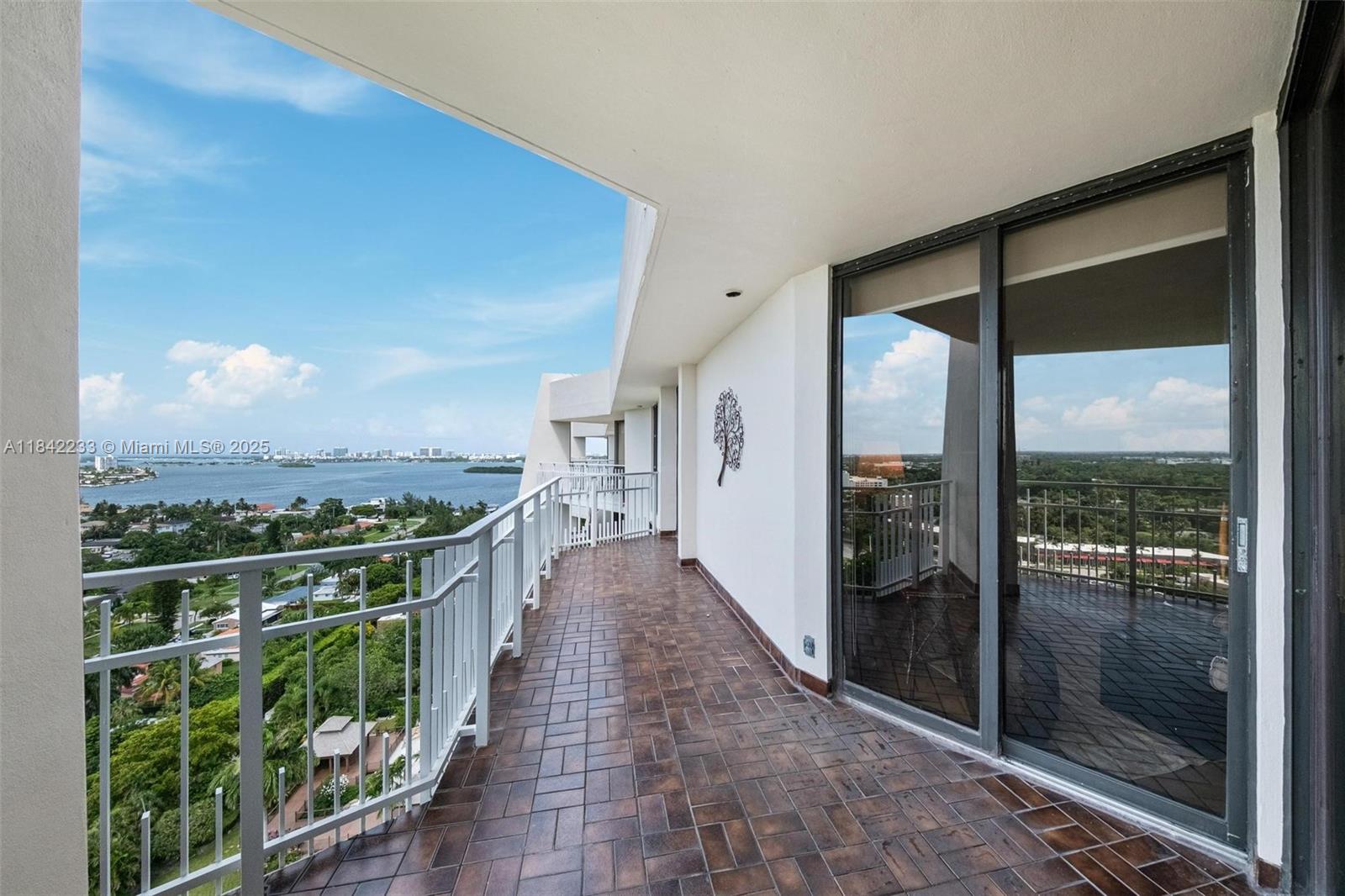 Turn-key 2BR/2BA Tower Suite on the 21st floor with expansive water views and extra-large open balcony. Fully furnished with elegant antique French/European Louis XV-style pieces. Features include parquet wood floors, spacious family room, and a flexible space ideal as a library or formal dining room. Remodeled kitchen with quartz countertops and updated bathrooms with glossy finishes. Located in a premier gated waterfront community offering resort-style amenities: full-service spa, daily fitness classes (aqua aerobics, yoga, spinning), 8 LED-lit clay tennis courts, racquetball, internet, cable & more—all included in maintenance.