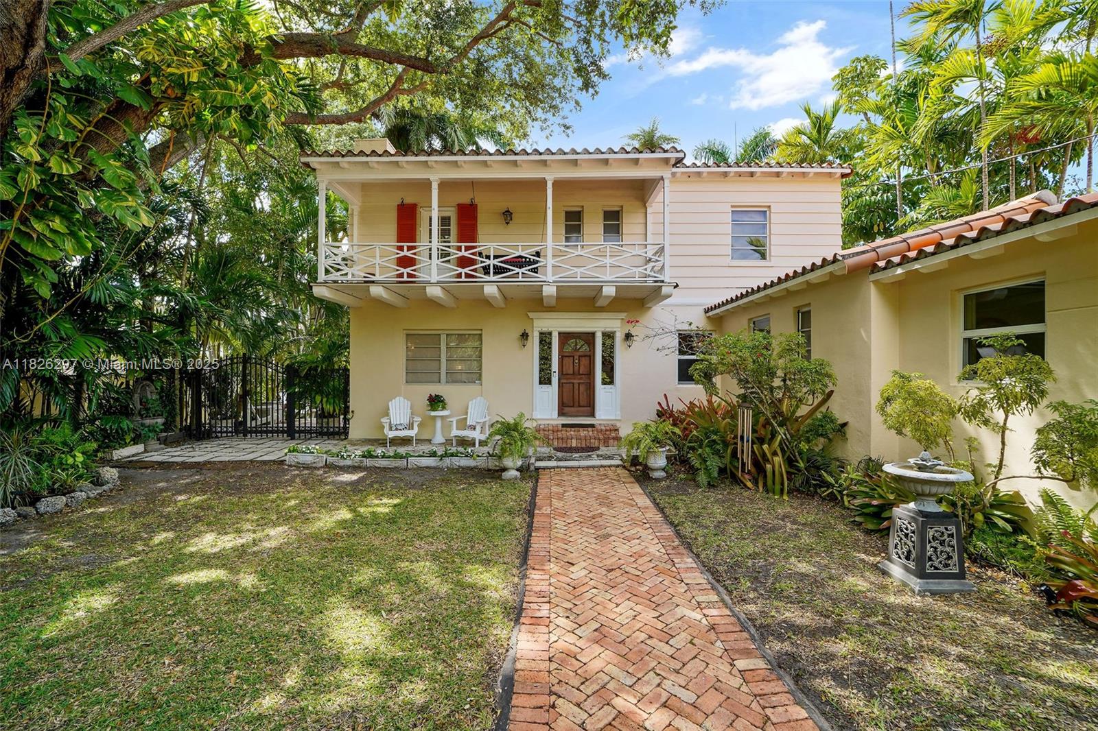 Charming two story home designed by renowned Miami architect, Carlos B. Schoeppl. The home is surrounded by lush landscaping and retains many of the original features, including the large Florida Keystone porch, fireplace, built-ins, crown moldings and original hardwood floors. Enter through the gated Chicago Brick driveway as the courtyard fits parking for three or more vehicles. A converted garage that can be used as an at home gym or office. Flexible floor-plan with en suite bedroom down stairs and enclosed Florida room can be used as den or play room. Located less than two blocks to LaGorce Country Club or the new 59th St. pedestrian walkway to Biscayne Bay.