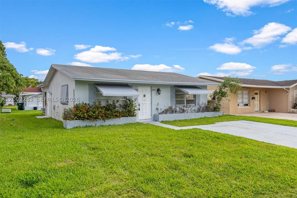Photo of 7505 NW 58th St, Tamarac, FL 33321 (MLS # A12002283)