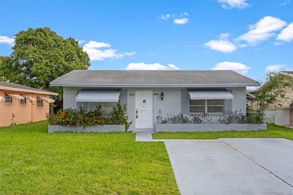 Photo of 7505 NW 58th St, Tamarac, FL 33321 (MLS # A12002283)