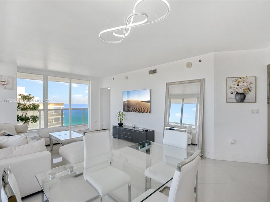 Enjoy breathtaking ocean, Intracoastal, and city views from this stunning 45th-floor corner unit, featuring a wraparound balcony for panoramic vistas. This home boasts high-polished marble floors throughout, stainless steel appliances, and granite countertops in the kitchen. Additional conveniences include an in-unit washer and dryer, impact windows for added safety, and luxurious building amenities. The building offers a state-of-the-art gym, multiple pools, Jacuzzis, sauna, steam room, and a billiards room. Short-term rentals are allowed. A perfect blend of elegance and comfort with exceptional views and amenities!