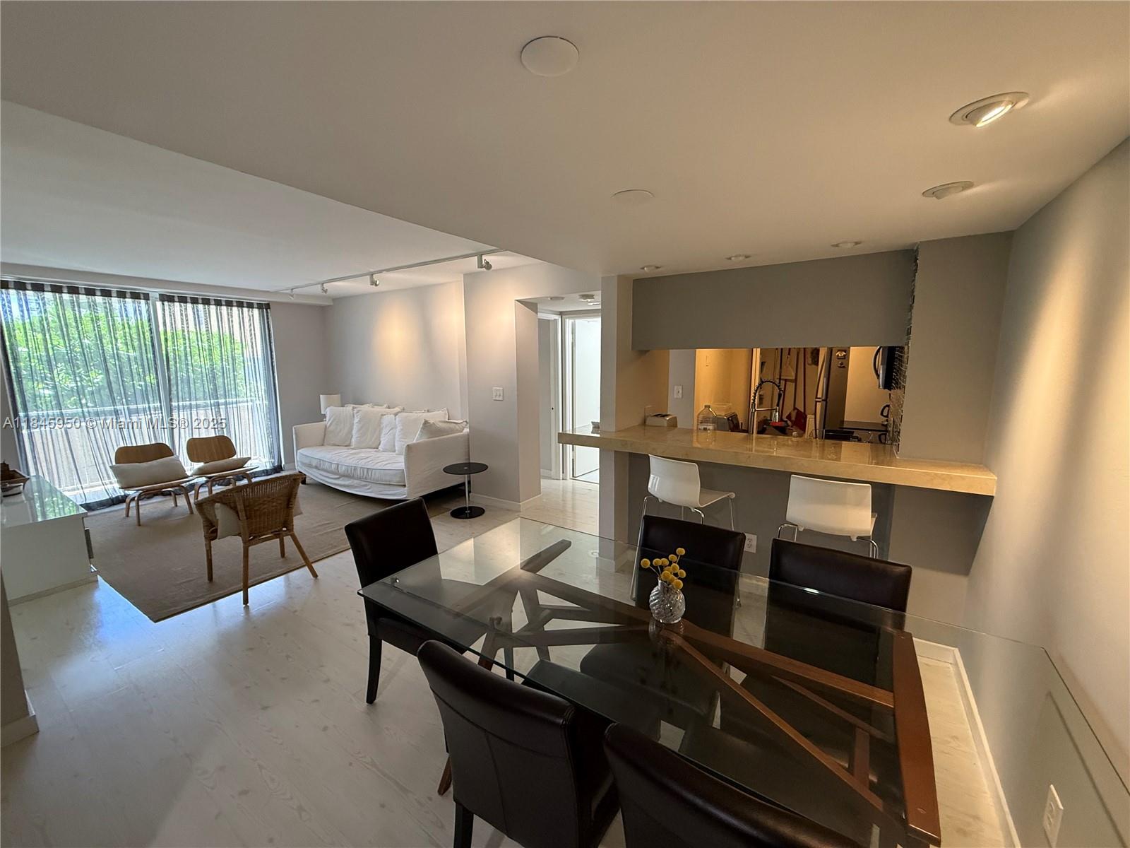 Beautifully furnished two-bedroom, two-bath condo offers an elegant, move-in-ready space on the same level as the pool and activities deck (one of the best in Brickell) —giving you effortless, elevator-free access to the water within seconds. Located in a quiet, gated Brickell Key community, the apartment features modern finishes, a split-bedroom layout, and a very clean, well-kept interior. The convenience of a washer and dryer inside the unit. Floor-to-ceiling glass invites natural light and bay breezes, and a spacious and private balcony. Building amenities include tennis, a waterfront gym, hot tub, BBQ area, valet, and 24-hour security. Moments from Brickell City Centre, Downtown, and top dining offerings. This waterfront residence blends island calm with vibrant urban convenience.