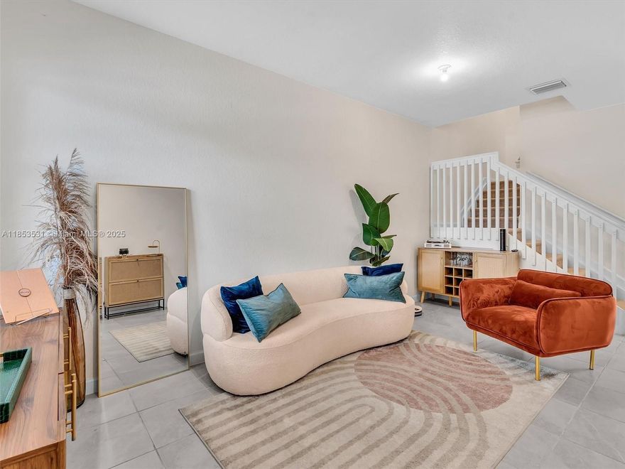 This beautiful newly built 3-bed, 2.5-bath townhome, offers chic sun-filled interiors with carpet upstairs and ceramic tile downstairs. The spacious master suite features a walk-in closet and a bathroom with dual sinks and a stand-up shower. The eat-in kitchen, complete with stainless steel appliances and a breakfast bar, seamlessly flows into the open-concept living and dining area. Step outside to a private backyard where a sitting and BBQ area awaits. Located in a gated community this home is just steps away from a dog park, kids' playground, resort-style clubhouse featuring a luxurious pool and jacuzzi lounge. Additional highlights include impact windows, a covered front porch, a 1-car garage with 4 car driveway, and it's just minutes from dining, shopping, highways, and Miami Airport.