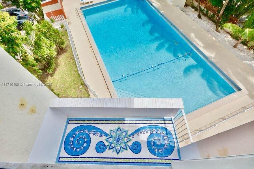 Own a living masterpiece crafted by renowned sculptor and painter Sergio Funari.This one-of-a-kind Miami duplex,renovated by Funari in 2015,is a true gallery in itself.The bathroom and shower feature hand-painted ceramic tiles,while a resurfaced 1930s bathtub,encased in custom mosaics,becomes a striking centerpiece in the bedroom.The terrace tiles evoke the charm of the Amalfi Coast,and the staircase showcases exquisite hand-painted details.A floating table suspended from the ceiling adds a bold artistic statement.Beyond its creative flair,the duplex offers modern upgrades,including a renovated kitchen,new floors,and breathtaking views of the pool and park.Additional amenities include two covered parking spots—exceptional feature in this building.The apt. is art to be lived in and admired.