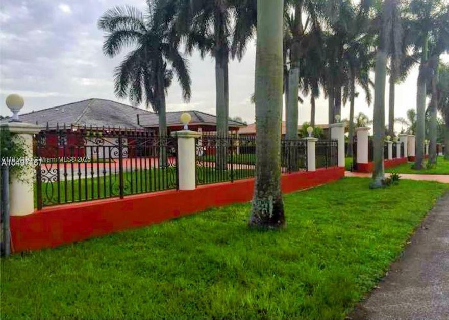 Beautiful gated property in the Redlands, with two residential buildings totaling 6,124 sf, set in a 1.25 acres lot, and surrounded by lush greenery.   The main house is a spacious 4/3, with formal dining room, breakfast area, living and family rooms, laundry, open rear porch and a 2 car garage. There is a circular driveway and electronic gates. The guest house/in-law quarters at the end of the property is a well designed 2/1 with its own wide covered porch. This property is move in ready.