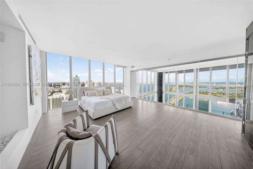 A Private Sky Estate at Marquis Residences Oceanfront Trophy Living.Rising above the Miami skyline, this extraordinary combined residence offers nearly 7,000 square feet of refined interior living space with unobstructed ocean and skyline views and the best price per square foot in Downtown Miami’s luxury segment. Seamlessly integrating three residences (5306, 5305 & 5304), this one of a kind home features 6 expansive bedrooms, 6 full bathrooms, and 2 half baths, designed for elevated living at the highest level. Walls of floor to ceiling glass frame breathtaking panoramic views, flooding the residence with natural light and creating an ever changing backdrop of water, sky, and city lights.
The primary suite is a private retreat in the sky, offering incredible panoramic views and its own dry sauna for a true spa-like experience. A dedicated theater room and a stunning main level executive office with spectacular open views provide both comfort and functionality within the home.
Grand living areas flow effortlessly for large scale entertaining while maintaining warmth and intimacy. This is high rise living without compromise scale, privacy, and presence rarely found in the sky.
The residence includes 4 assigned parking spaces and access to the full service lifestyle of Marquis. Ideally located in the cultural and financial heart of Miami. An irreplaceable opportunity to acquire a trophy-scale residence at unmatched value per sft. Cryptocurrency transactions are welcome.