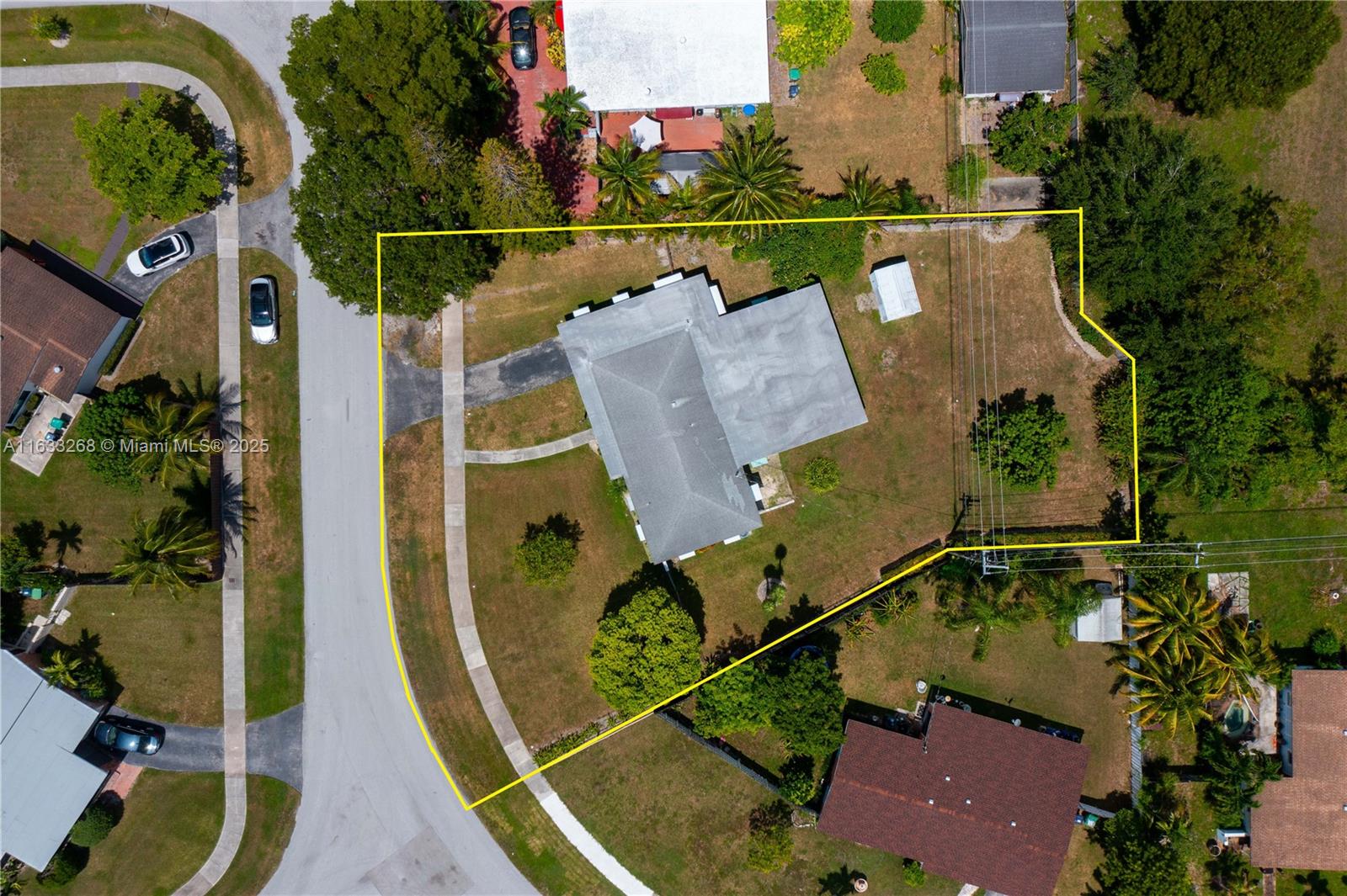 PRICE CUT! YOUR FIRST HOME AWAITS! Best-Priced Opportunity in Prime Location! Discover this great property with immense potential, perfect for creating a dream home with ample space to add a swimming pool, plenty of room for a boat or RV & electrical hook-up for an RV. Virtual tour avail.This home sits on one of the largest lots for sale in the area, spanning an IMPRESSIVE 15,041 sq. ft. Enjoy the traditional Florida room & a wonderful screened back porch, ideal for relaxing & entertaining.Located steps from Palmetto Bay Park & US1,this property is in an X flood zone, offering peace of mind.Additionally, the lush lot features tropical fruit trees.The house is recorded as a 3-bedroom, 1-bathroom home in public rec.,but it boasts 4bedrooms & 2bathrooms, providing ample space for your family