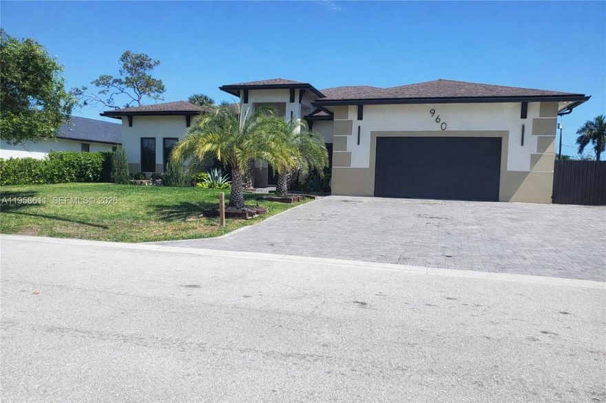 Experience luxury living at its finest this beautiful home was built in 2025. The home features Five Bedrooms and  Five and a half bathrooms, all bedrooms have there own bathroom and walk in closet except for one. The  Grand master bedroom features Two Wak in closets and a Huge Bathroom with a Double shower, Double sink, solid free standing tub, with a Sauna in the bathroom. The home also Features a Brand-New Pool with a Sun Deck. The Kitchen has White Solid Wood Cabinets with a Beautiful Rare One-of-a-kind granite throughout, the kitchen Island features a granite waterfall.  New Double Frig, in addition to a Wine Frig, Spectacular Hand Crafted Oven Hood over the Gas stove, Vaulted Ceilings throughout the house.  This 4 Bedroom 5 and 1/2 bathroom plus an office is the perfect retreat to enjoy and relax and at the same time be in the Heart of West Palm Beach, you are a couple minutes away from The PGA Mall, The Outlets of Palm Beach, couple minutes to Beaches, and right by the Palm Beach International Airport.