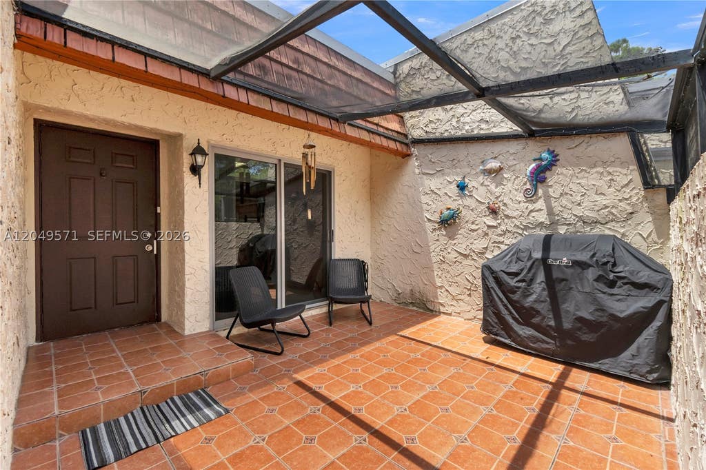 Photo of 9820 NW 65th Ct #B13, Tamarac, FL 33321 (MLS # A12049571)
