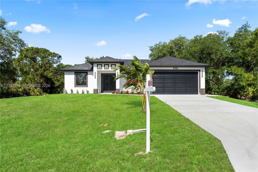 Discover modern living in this brand-new 1-story single-family home in Lehigh Acres! This 3BD/2BA residence offers over 1,500 sq ft under air with a bright open-concept floor plan, fully tiled throughout with a sleek and modern  finish. The designer kitchen features quartz countertops, stainless steel appliances, and a spacious island perfect for entertaining. Enjoy impact windows and doors, a dedicated laundry room with washer & dryer included, water filtration system, 2-car garage, extended driveway, patio, septic tank, and a generous .25-acre lot with no HOA restrictions. Seller is offering $5,000 toward buyer’s closing costs and prepaids — an incredible opportunity for homeowners and investors alike!