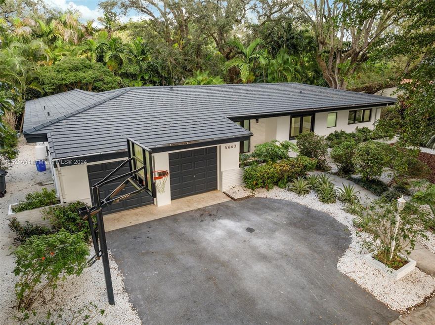 Elegantly renovated, this splendid residence in Coral Gables boasts exquisite beauty. Comprising four bedrooms and three full bathrooms, it graces a 10,000 square foot lot nestled on a serene street adorned with nature's wonders. Designed for both tranquility and entertainment, the expansive backyard, adorned with lush greenery, and a charming deck provide a delightful setting. Within, the property seamlessly blends spacious interiors for hosting gatherings with a tastefully designed open concept that also prioritizes privacy. An idyllic haven, this property harmoniously combines sophistication with the allure of natural surroundings.