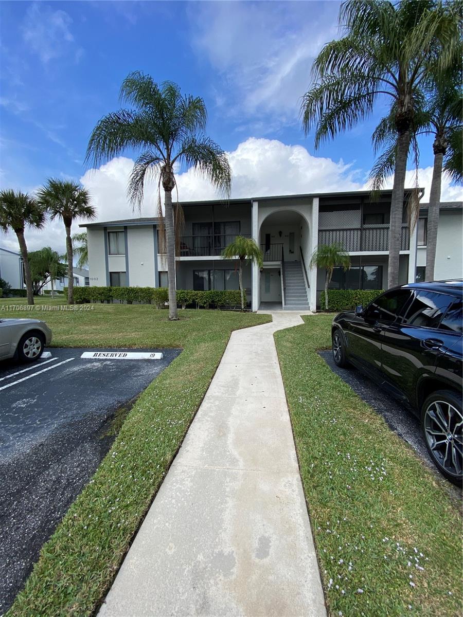 Discover at an unbeatable price, this spacious and beautiful 1st floor condominium, with Excellent Amenities, with featuring brand-new white quartz countertops and stainless steel appliances in excellent condition. Enjoy the convenience of a newer AC unit, a spacious laundry room with a large washer and dryer, and a generously sized balcony. The condo boasts tile flooring throughout, offering a sleek and modern look. Located just steps away from the Clubhouse, which includes a swimming pool, tennis courts, and manned security at the gate. Additionally, the property is adjacent to a picturesque lake with a walking path, perfect for peaceful strolls and outdoor enjoyment. The location is ideal, with everything you need nearby. Don’t miss this gem – it won’t last long!
