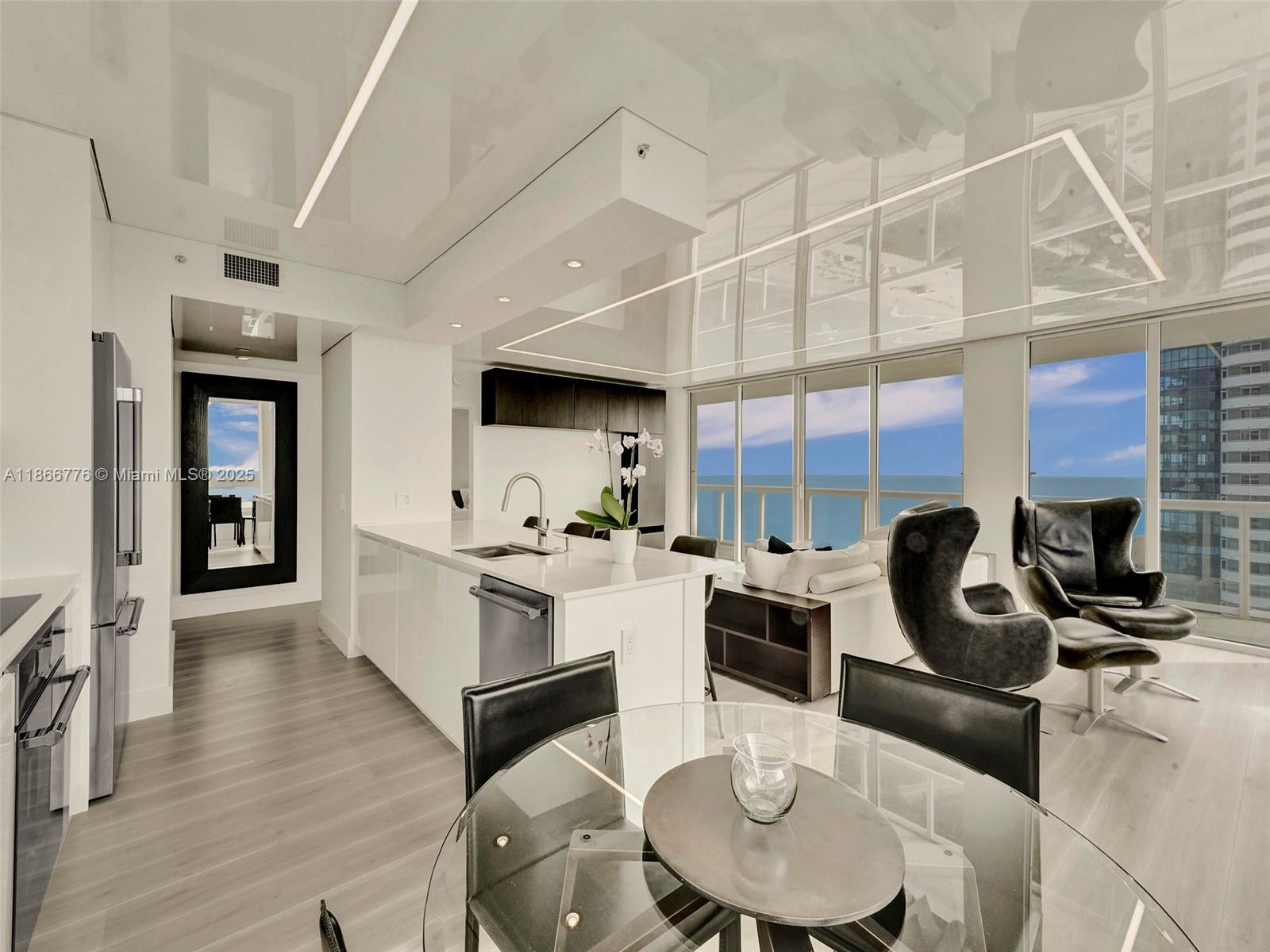 Stunning, sun-filled two bedroom and two baths luxury residence located in the heart of Miami Beach. Recently renovated this modern stylish condo offers an ideal retreat for individuals seeking a luxurious beach lifestyle. Akoya offers luxury upscale amenities including an oceanfront state-of-the-art fitness center, tennis, pickleballcourt, game room and beach service. The open-concept living space of the unit allows for seamless flow and thegourmet kitchen boasts top-of-the-line Thermador appliances, a wine cooler, sleek cabinetry and ample counterspace. The unit features a wrap-around balcony with amazing ocean, intracoastal and city views. Walk to restaurants, shops and everything Miami offers. Just minutes away to Bal Harbor, Design District and MiamiInternational Airport.
