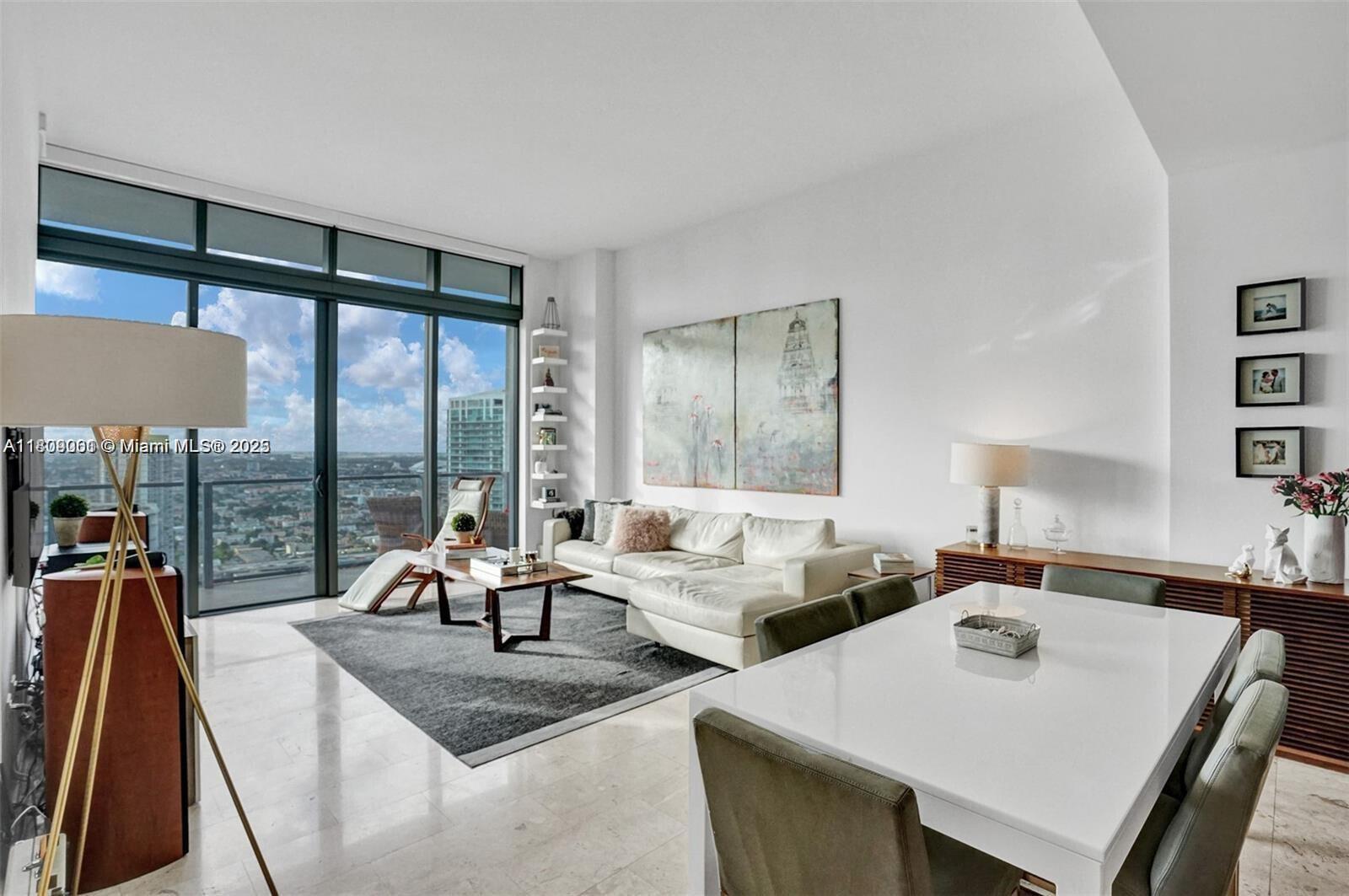 World-renowned exclusive modern building; Reach at Brickell City Centre. Stunning 2 Bed/2 Bath condo with same 11.5ft ceiling height as penthouse units offering mesmerizing 40th floor's views of Brickell skyline & Miami River! Features large balcony terrace, marble floors throughout, open kitchen w/cook island, Italian cabinetry, quartz counter tops, high-end appliances, floor-to-ceiling sliding impact doors & windows, walk-in closets, master bath w/frame-less glass shower, separate soaking tub, his & hers sinks, electronic toilet/bidet & more. Resort-style amenities include pools, Jacuzzi's, bbq area, state-of-the-art fitness center, complete spa, children play area, 24-hr concierge, valet parking & more! Basic cable and internet included in rent.