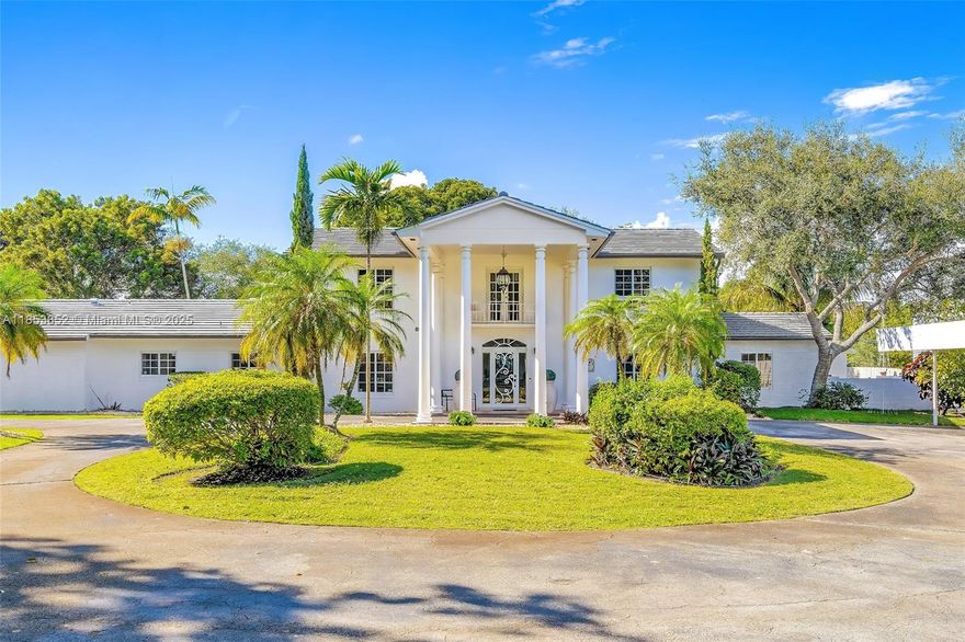 Nestled within the Village of Pinecrest on a rare gated corner parcel exceeding one acre, this exquisite Colonial Revival estate marries timeless architectural elegance with sophisticated modern living. With seven bedrooms and 6 & a half baths, a chef’s gourmet kitchen with butler’s pantry, top-tier upgrade details like a new roof and impact-rated windows, the home is bright, airy and perfect for both refined entertaining and relaxed family life. This unique offering blends privacy, land, and elegance in one compelling package.