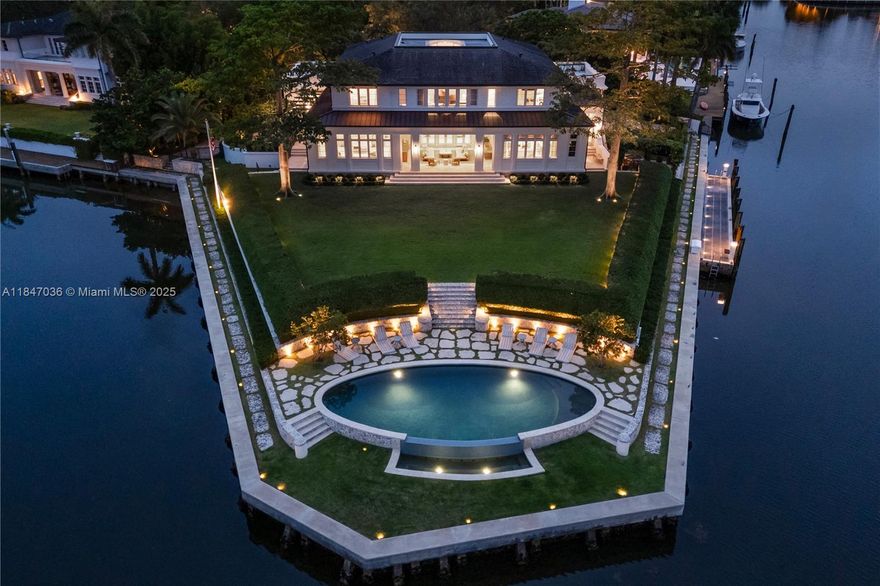 Fully reimagined and completed in 2025, this waterfront estate in Old Cutler Bay sits on a rare one-acre peninsula with 435 feet of water and a 75-foot dock. Spanning over 19,000 SF, the smart home offers 7 bedrooms, 7 full, 2 half bathrooms, a luxurious primary suite with a movie room, and water views from every room of the house. Designed for both everyday living and grand entertaining, the home features formal and informal living areas, a chef’s kitchen with three Sub-Zero fridge/freezers, a temperature-controlled wine cellar, bar, full home gym, massage room, and spa. Outdoors, a resort-style pool sits at the tip of the peninsula overlooking the bay, complemented by a full summer kitchen, pizza oven, cabana bath, and fire pit. The 18-car garage completes this exceptional offering.