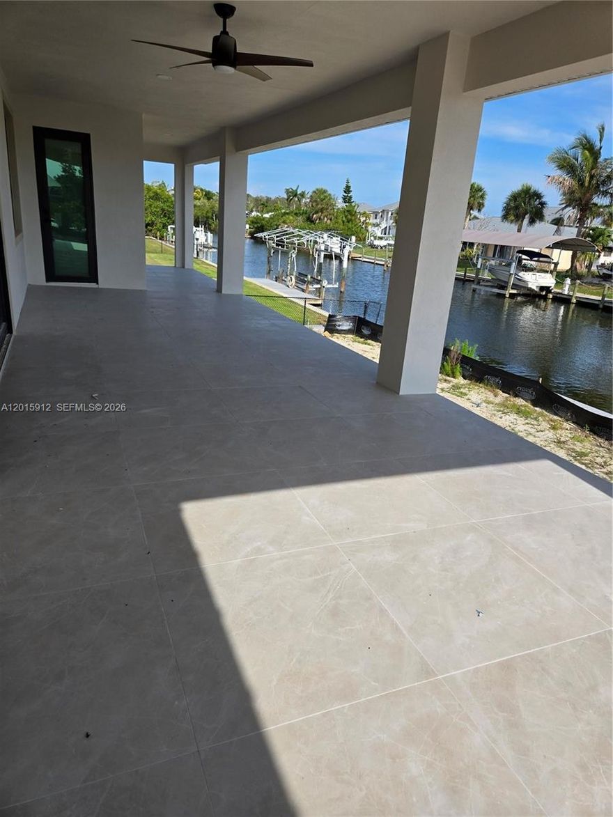 EXPECTED COMPLETION JUNE 2026. TAKE ADVANTAGE OF CONSTRUCTION PRICING!
Boasting 4129 square feet of total area, NO HOA - this 4-bedroom, 4-bath house sits on a saltwater canal with no bridges to the bay, a three-car garage, 100' dock, pool, lanai, open concept kitchen with an island, cabana bath. Located in Pirate Harbor, one of Punta Gorda's premier waterfront communities. With no bridges & direct access to Charlotte Harbor and the Gulf Islands, this neighborhood is one of the quickest to open water in Southwest Florida. This home site includes city water and sewer. True fishing neighborhood. It is not unusual to see dolphins and manatees in front of your new home. Very low traffic patterns in Pirate Harbor, as every street dead-ends. Snook, redfish, snapper, tarpon, and many other species live year-round in Pirate Harbor.