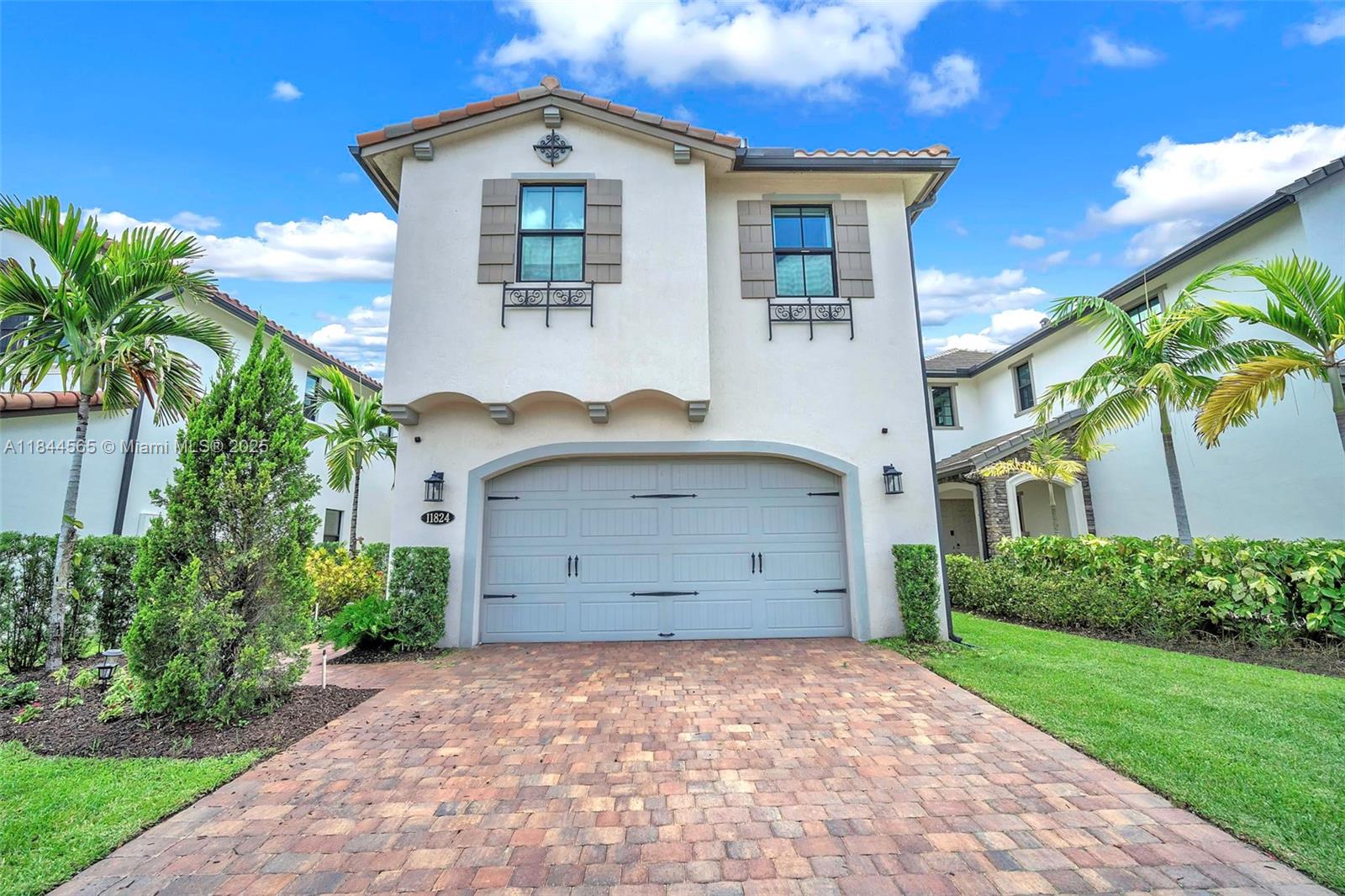 Perfectly lovely & spacious family home with 4 Bed/3.5 Bath + office + mezzanine & primary+1 with ensuite baths. 2900 SF beautifully laid out w 24x24 ceramic tile downstairs & carpet upstairs. All closets are customized and all bedrooms have blackout window treatments. Open & expansive, this great area features striking zebra blinds. Kitchen boasts white cabinetry (some windowed) & contrasting dark quartz counters. Center aisle, countertop stove, wall ovens & soft-close drawers all included. Great area has tasteful ceiling lamps sunken lights. Your primary has a water view complemented by double closets, double sinks, a separate shower & tub beautiful white cabinetry. All this in a well-groomed community with a heated pool & gym. Close to I-75 & popular shops, restaurants & services.