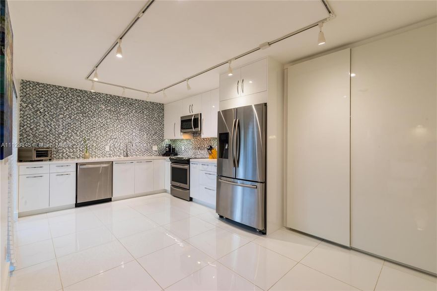 Beautiful Home in the heart of Plantation! Ceramic floors on ground floor, All updated appliances in the kitchen. Smooth ceiling finish. 2 bedrooms 2.5 baths townhouse. Walk up the wood staircase with metal rails into the upstairs. Custom walk in closets. hurricane accordion shutters on all sliding doors. Updated blinds on all windows. Enclosed outdoor patio features beautiful tile floors.  All electrical, and heater was installed new when current owners moved in.  Central Vacuum system downstairs and upstairs. This is a must see. Don't miss this opportunity to purchase this property.