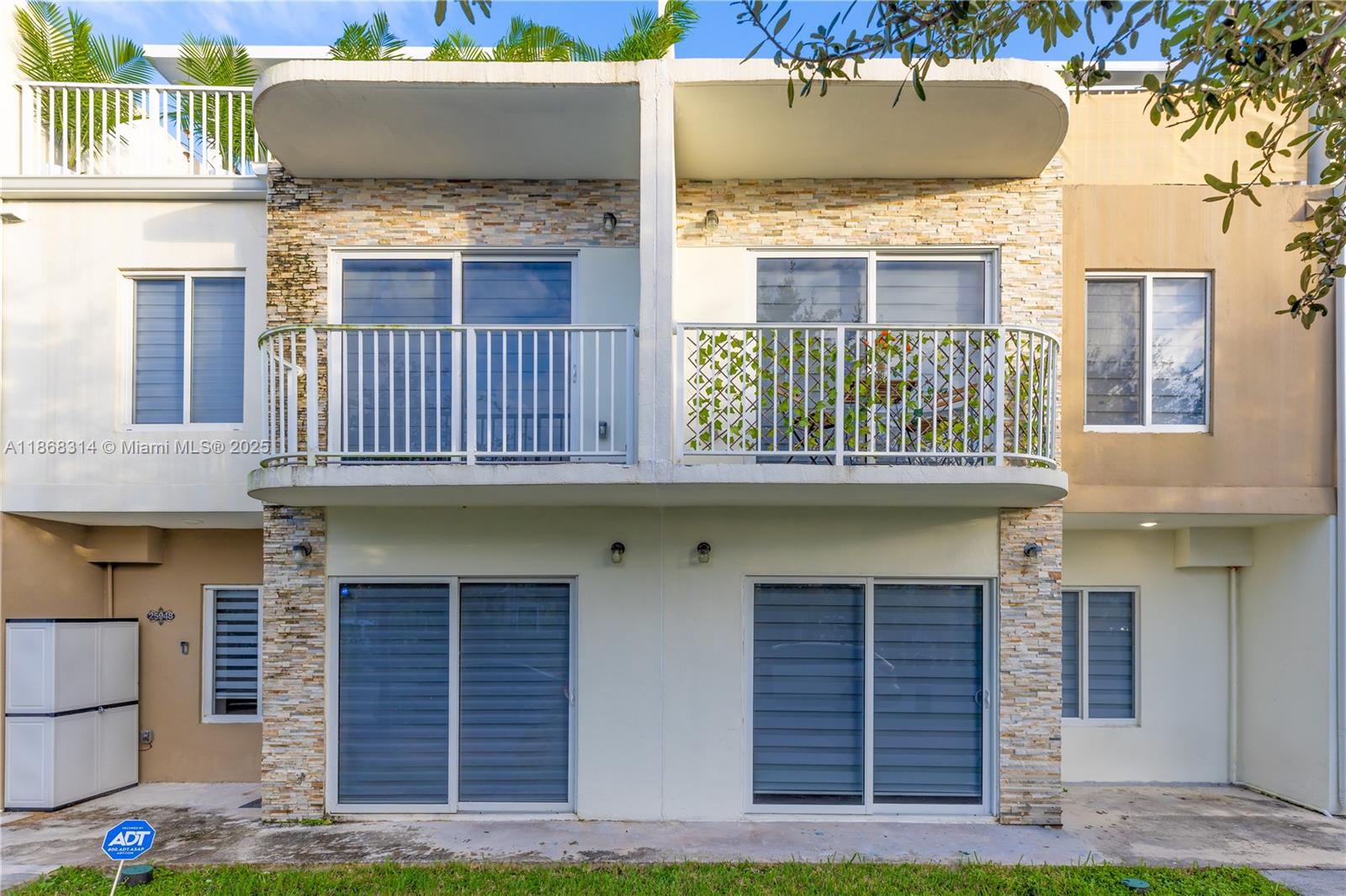Stunning 4-bed, 3.5-bath modern townhouse with tropical design. The first floor features an open-concept living space filled with natural light, a bedroom with full en-suite bath, and a guest half bath. The kitchen offers stainless steel appliances, quartz countertops, and a large island. Upstairs, the master suite includes a private balcony, walk-in closet, and en-suite bath. Enjoy a private rooftop terrace with pergola, outdoor TV area, and panoramic views, perfect for entertaining or relaxing. Washer/dryer in unit.