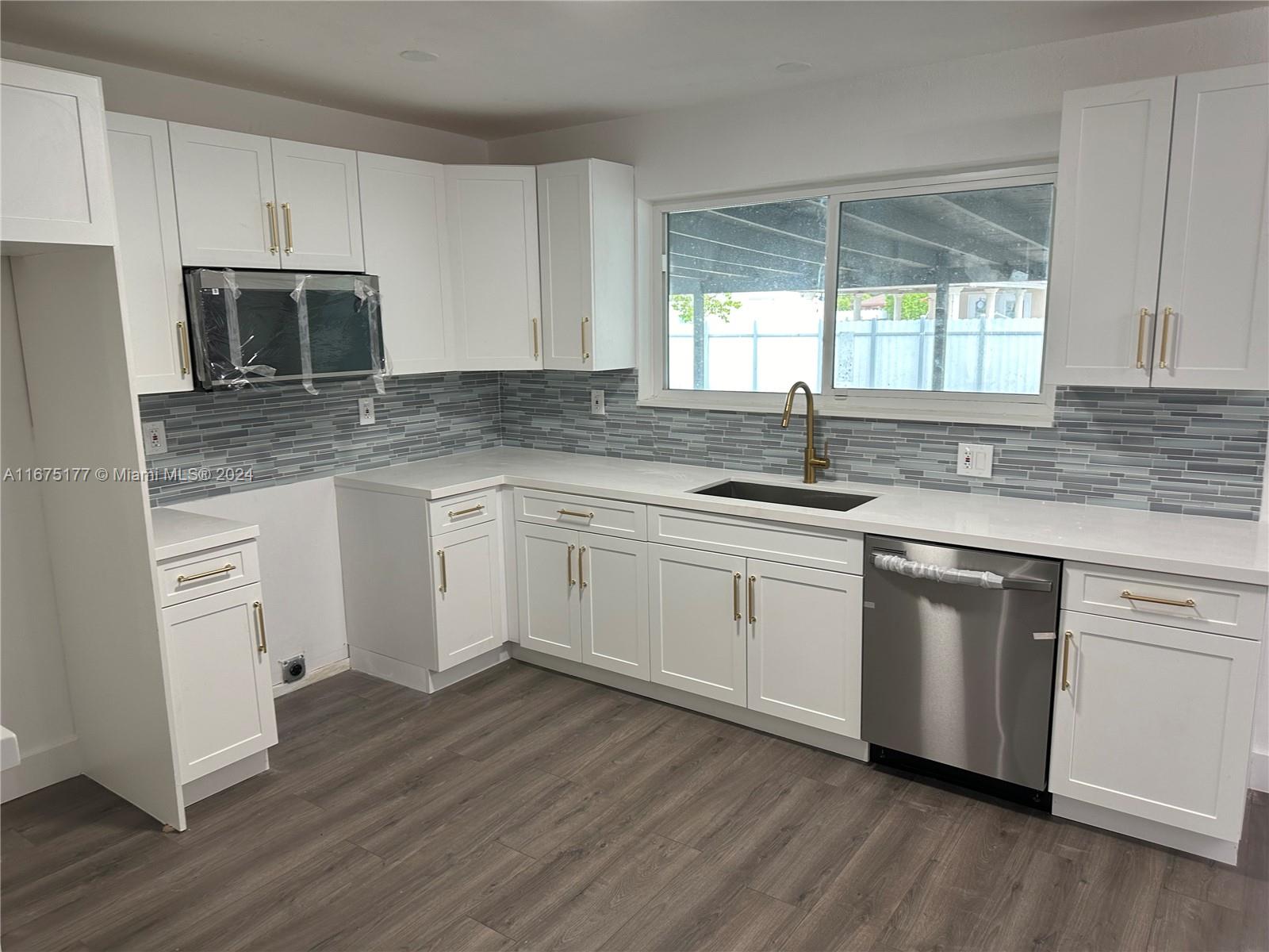 This is a beautifully remodeled 4 bed 3 bath that has close to 2000 sq feet of living space. There is also an in-law quarters with independent entrance to use for added income that can easily rent for $1500. One of the 4 bedrooms also has a private entrance and has the option to be used for additional income as well. This home is ready to move in as everything has been updated with modern and elegant finishes. Perfect for an extended family or an investor. No HOA. Very low taxes. *********Appraised at $625K********* Please click on showing request for showing instructions, possible buyer contribution to help with closing costs and buyer's agent incentive/contribution.