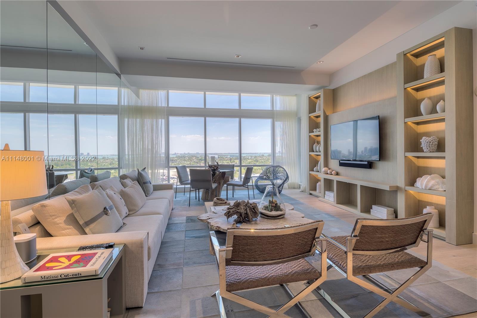 Welcome to an awe-inspiring entrance with soaring floor-to-ceiling windows offering stunning views of the Miami skyline. This highly sought-after 2-bed penthouse at 1 Hotel & Homes boasts stunning upgrades, including a custom furniture package by Artefacto. The bedrooms offer ample closet space while the private balcony and chef's kitchen with top-of-the-line appliances make for a perfect retreat. The entire residence has oak wood floors throughout. The master bedroom is a serene sanctuary with a resort-like ensuite master bathroom. Enjoy personal concierge services and full-time staff in the private residence lobby along with four pools, four restaurants, three bars, a 14,000 sqft gym, Bamford spa, hair salon, Soul Cycle, children's area, valet attendants, and chauffeured house cars.