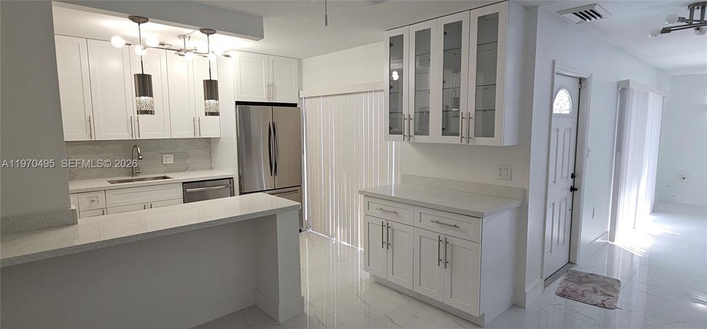 Photo of 3310 S Meridian Way #B, Palm Beach Gardens, FL 33410 (MLS # A11970495)