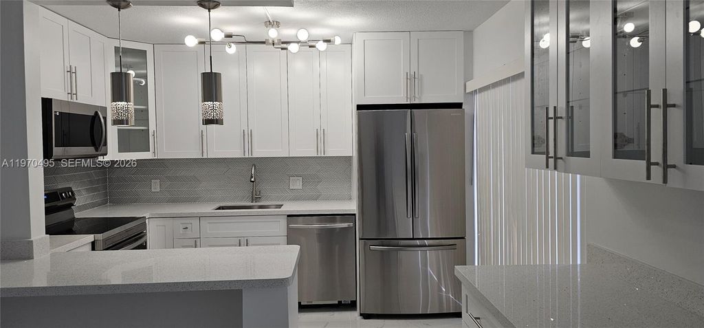 Photo of 3310 S Meridian Way #B, Palm Beach Gardens, FL 33410 (MLS # A11970495)