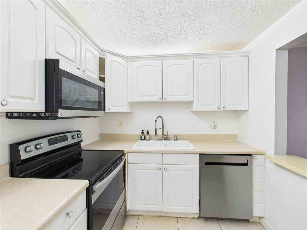 Photo of 4113 NW 88th Ave #105, Coral Springs, FL 33065 (MLS # A11826660)