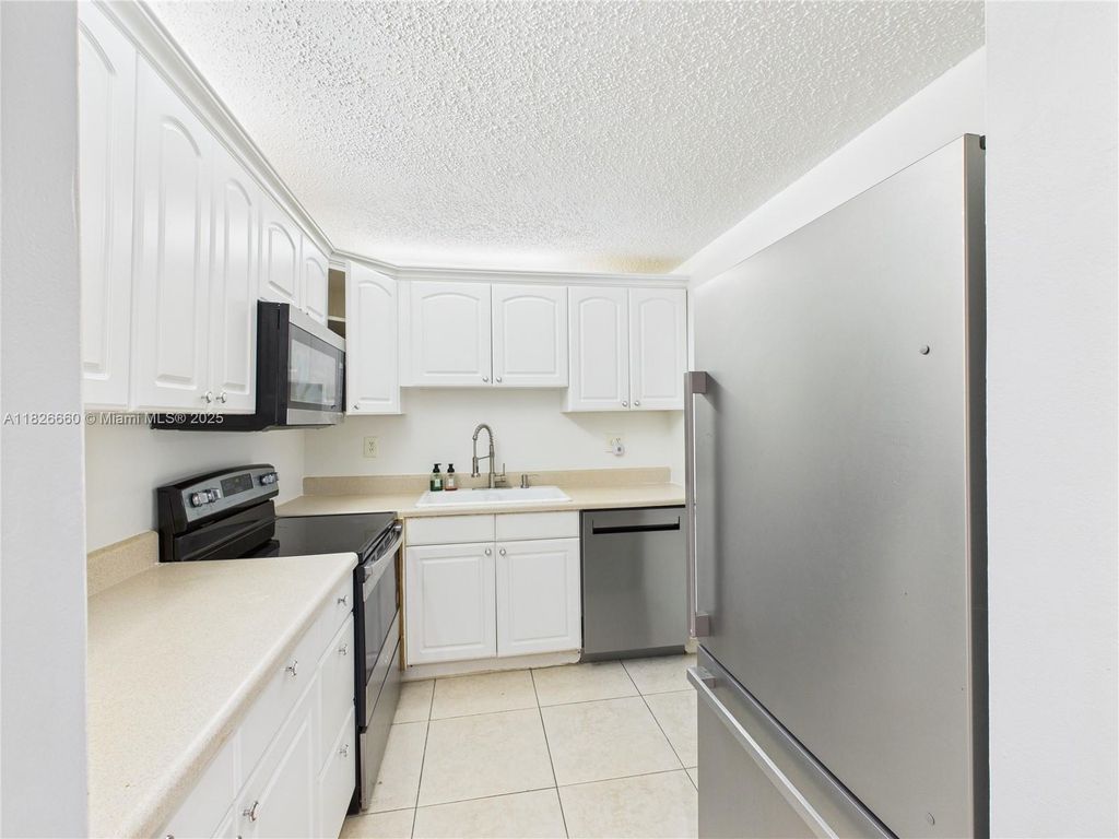 Photo of 4113 NW 88th Ave #105, Coral Springs, FL 33065 (MLS # A11826660)