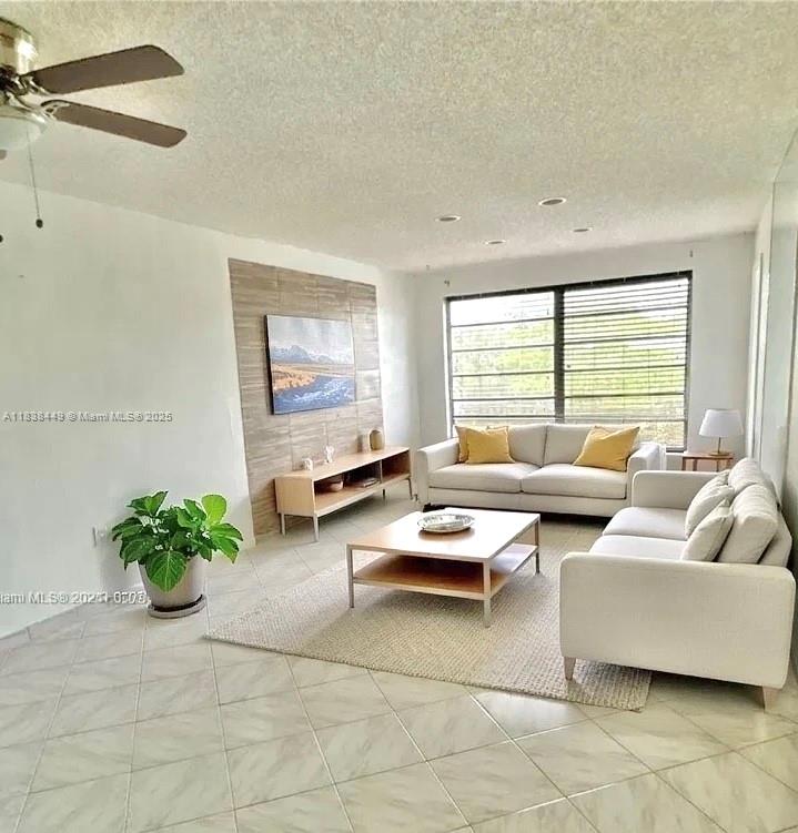 Huge reduction! Vacant 2/2 in the heart of Plantation. LAUNDRY IN-UNIT. The apartment is on the top floor with a beautiful view of the pool area from the screened balcony. Updated bathrooms. Newer A/C. Tile throughout. Spacious and bright. It's a great deal for the price! Hot water is included in the maintenance fee. New building elevator. Preferred location close to shopping and restaurants. Enjoy a variety of amenities with the whole family. Selling "AS-IS". Some photos were virtually staged.