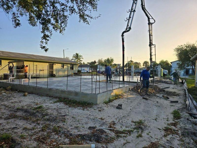 A vacant residential lot with partial construction already developed and ready to erect walls as the next step.