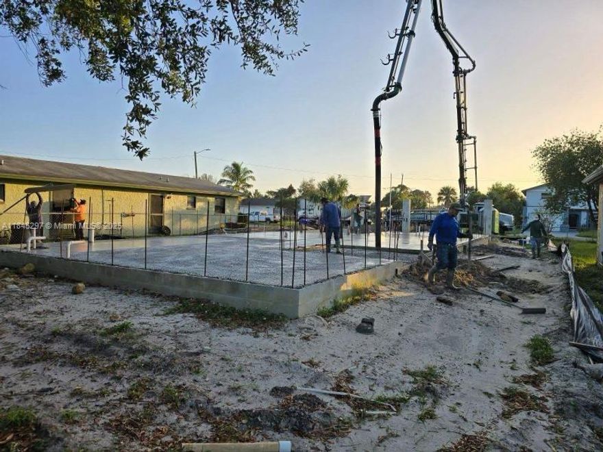 A vacant residential lot with partial construction already developed and ready to erect walls as the next step.