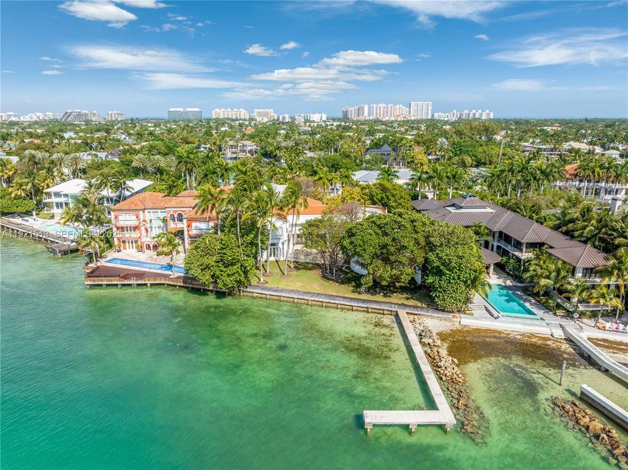 A rare offering on Key Biscayne’s only private road, this expansive 28,800 sq. ft. waterfront estate captures mesmerizing Miami skyline views from its secluded beach and private dock. One of the few properties of its kind, it combines unmatched privacy with a dramatic contemporary design celebrated as part of the Rosa de la Cruz Collection. Towering 20-ft ceilings, sculptural lines, and vast, light-filled spaces create a breathtaking backdrop for art, entertaining, or reimagining the home to your personal vision. A truly exceptional canvas in an irreplaceable location.