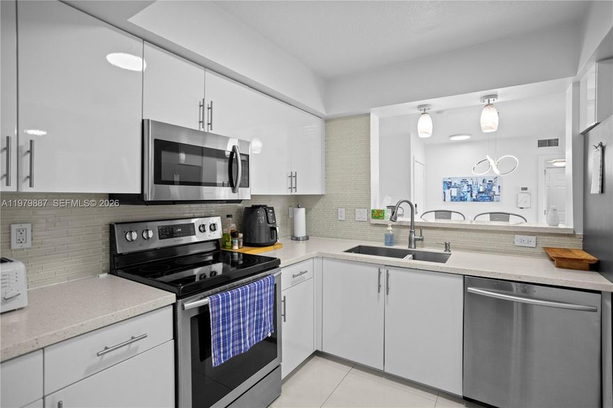 **WOW**NONE NICER & REDUCED** MOVE RIGHT IN THIS TASTEFULLY, COMPLETELY REMODELED AND FULLY FURNISHED UNIT** SOUTHERN EXPOSURE OVERLOOKING THE COMMUNITY POOL, JUST MINUTES FROM THE BEACH, STORESM AIRPORT AND MUCH MORE...**