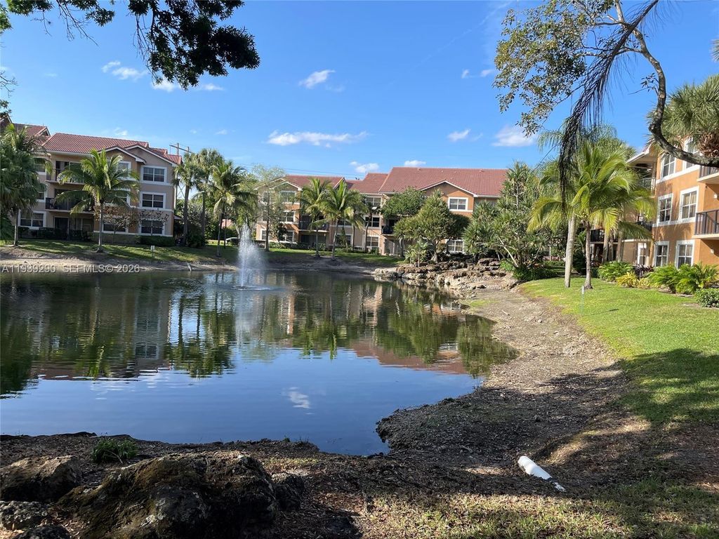 Photo of 8821 Wiles Rd #101, Coral Springs, FL 33067 (MLS # A11939290)