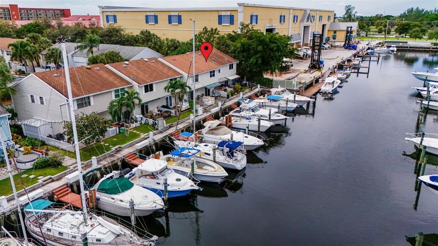 Experience waterfront living in this updated 2BR/2.5BA deep-water townhome with direct Intracoastal access and no fixed bridges—ideal for boaters and coastal living. Enjoy canal views from your private patio, perfect for relaxing or entertaining. Interior features include an open layout, granite kitchen with Whirlpool appliances, new upstairs flooring and staircase (2024), newer air handler (2021), and tankless water heater (2016). Dock ownership is separate, with priority to community owners when slips become available; rentals may be possible. Loggerhead Hidden Harbour Marina is next door for extra boat storage. Fee simple (not condo) with low $210 HOA, FHA eligible. Roof replaced prior to ownership. Leasing allowed immediately (min 4 months). Minutes to beach, dining & shopping.