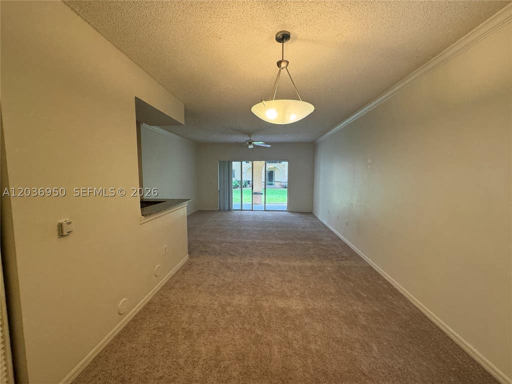 Photo of 2492 Centergate Dr #102, Miramar, FL 33025 (MLS # A12036950)