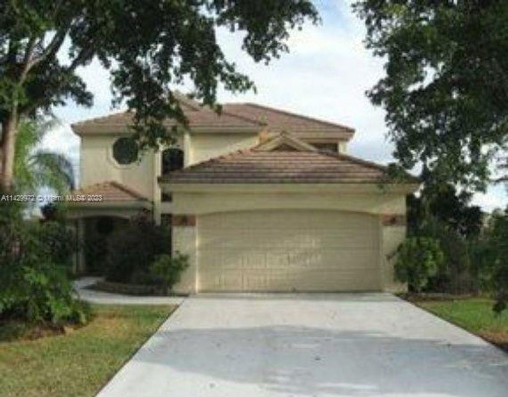 Photo of 6430 NW 58th Ter #6430, Parkland, FL 33067 (MLS # A11429972)