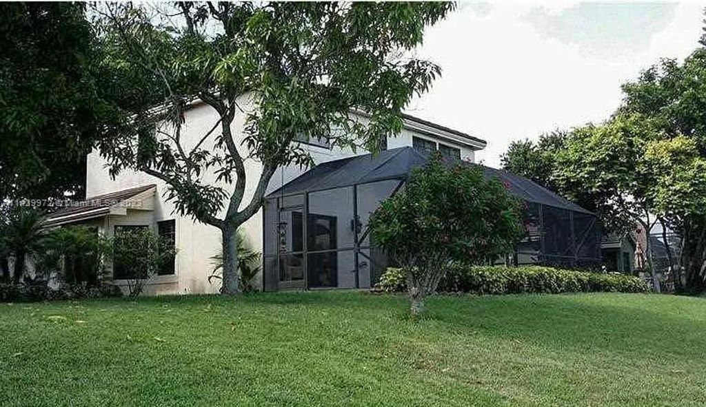 Photo of 6430 NW 58th Ter #6430, Parkland, FL 33067 (MLS # A11429972)