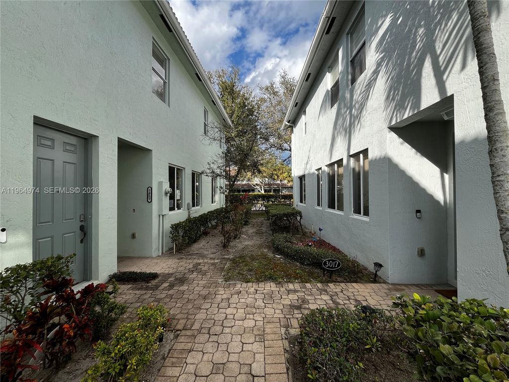 Photo of 3021 Laurel Ridge Cir, Riviera Beach, FL 33404 (MLS # A11964974)