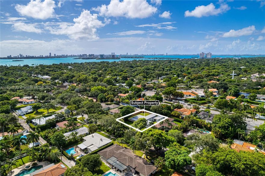 Welcome to this modernized mid-century modern home situated on a quiet street in the heart of Miami Shores! Upon entry, prepare to be captivated by the light & bright interior & open layout seamlessly blending the main living room w/ the kitchen & dining areas. Spanning 2,831 SF & featuring 4 generously sized bedrooms & 3 bathrooms, this home offers the perfect balance of space and functionality. The sleek gourmet kitchen boasts brand new modern appliances & eat-in island. The oversized primary suite includes a massive walk-in closet & spa-like bathroom w/dual sinks & dual rainfall shower heads. The expansive backyard offers endless possibilities w/ room for a pool. Additional highlights include a new roof, septic system, AC, plumbing & electrical. This Miami Shores home will not last!