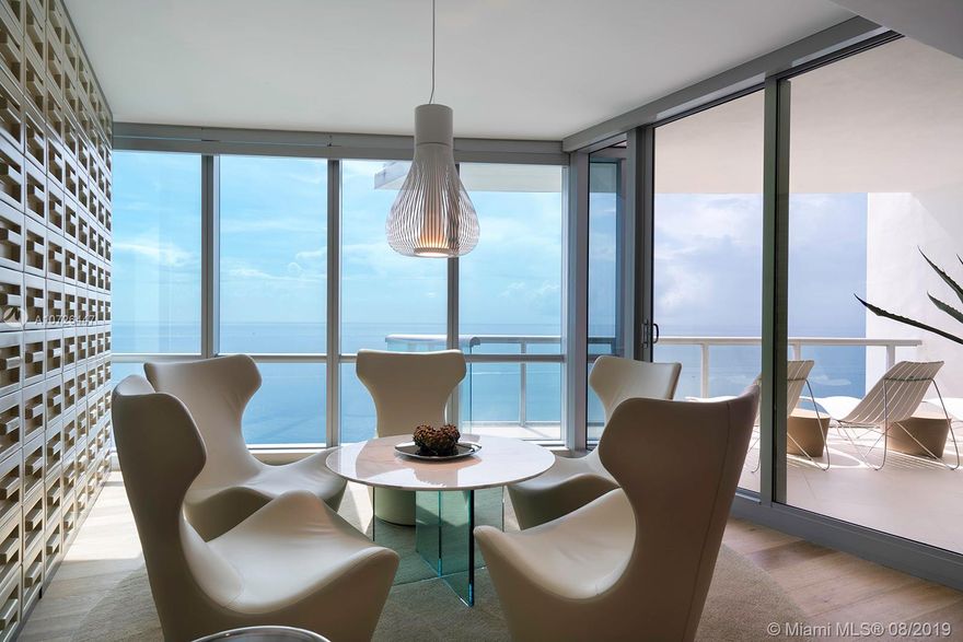 Amazing deal! Welcome to paradise! Enjoy unobstructed, breathtaking ocean & fabulous intracoastal/city views from this unique, one of a kind, luxurious residence in the sky featuring 4360 SQ FT of living area + 854 sf in 4 terraces. This stunning smart home comes exquisitely  designed and decorated by internationally recognized interior designer, Juan Poggi;  featuring french oak wood floors, custom furnishings, automated window treatments, surround sound, programmed lighting, master-suite with office, formal living, dining areas, 2 private elevator entries, 4 parking spaces & 2 storage units and more. Jade Ocean offers world class amenities, full  service spa, 2 infinity pools,, top of the line  gym with direct ocean views,  business center,  kids playroom, cinema +