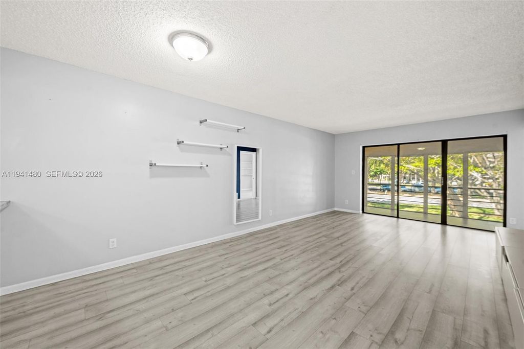 Photo of 2302 S Cypress Bend Dr #210, Pompano Beach, FL 33069 (MLS # A11941480)