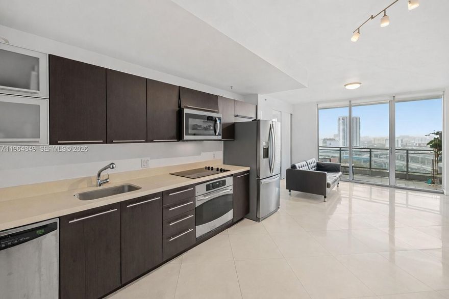 Experience elevated city living in this spacious 1 Bed, 1 Bath residence at Ivy Condo, a gated riverfront community in the heart of Miami. Perched on the 16th floor, this 736 SF home showcases unobstructed city views that shine day and night, plus a private balcony to take it all in. The thoughtfully designed floor plan easily accommodates a work-from-home setup. The modern kitchen is equipped with updated appliances, while a smart Nest thermostat allows remote climate control. Newly installed rolling blackout shades in the bedroom and additional shades in the living area provide privacy and comfort at any hour. The bathroom features a sleek, updated vanity with generous storage and a contemporary shower design with custom glass and tile. A fully built-out closet and separate linen closet add everyday functionality. One assigned parking space included. Built in 2008, the building has recently completed major capital improvements, including refreshed lobby and hallways. Residents enjoy 24-hour front desk and valet service, spa with steam and sauna, expansive pool deck, BBQ area, children’s playground, and club room. Ideally located along the Miami River, just moments from Brickell City Centre, world-class dining, shopping, and entertainment. Easy access to I-95, Miami Beach, Wynwood, Midtown, Edgewater, and Miami International Airport. Available for immediate occupancy.