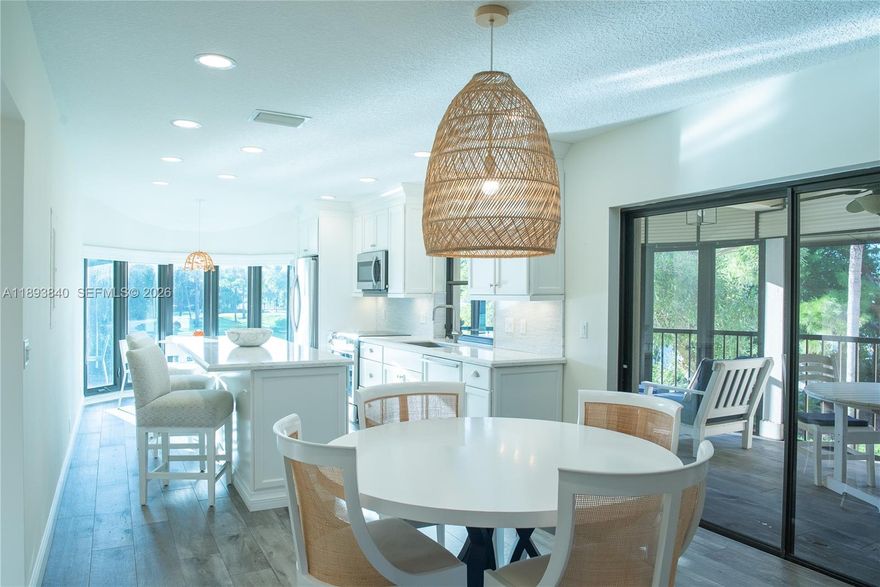 Enjoy breathtaking lake views from this beautifully maintained second-floor condo in the highly sought-after Waterbend community of Jonathan’s Landing. This light-filled home offers two spacious bedrooms plus a versatile den, ideal as a third bedroom or office. The updated eat-in kitchen and open living areas feature gleaming hardwood floors and stunning water vistas throughout. Relax or entertain on the  screened porch and take in peaceful mornings or vibrant sunsets over the lake. 

Jonathan's Landing is a private golf community in Jupiter. Three championship golf courses, a fitness & tennis center, ten tennis courts, and renovated club houses. Membership available but not mandatory. There is a one-time mandatory capital contribution to JL POA of $2,152. Quarterly HOA dues of $3,475.